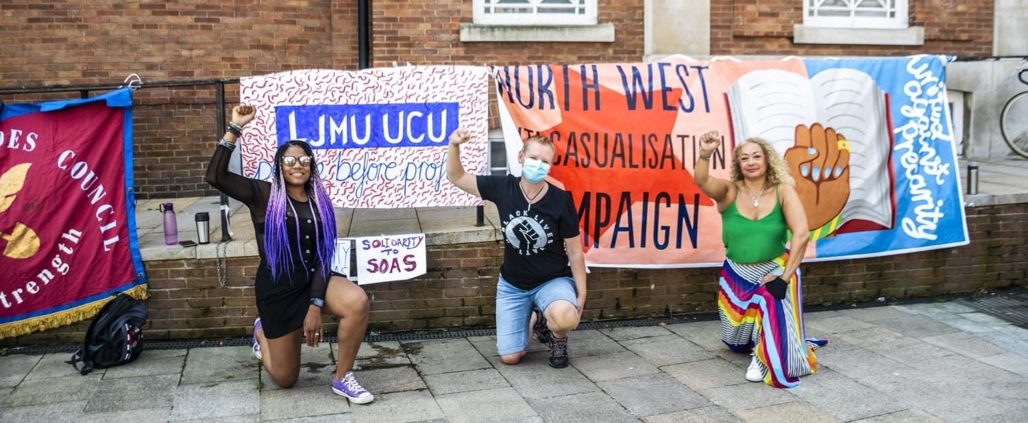 Branch president Peta taking the knee alongside members of BLM Liverpool. Banners in the background read 'LJMU UCU' and 'North West anticasualisation campaign'